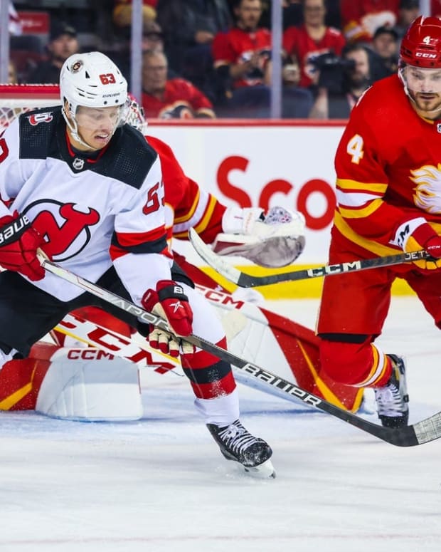 Nov 5, 2022; Calgary, Alberta, CAN; New Jersey Devils left wing Jesper Bratt (63) controls the puck against the Calgary Flames during the first period at Scotiabank Saddledome. Mandatory Credit: Sergei Belski-USA TODAY Sports